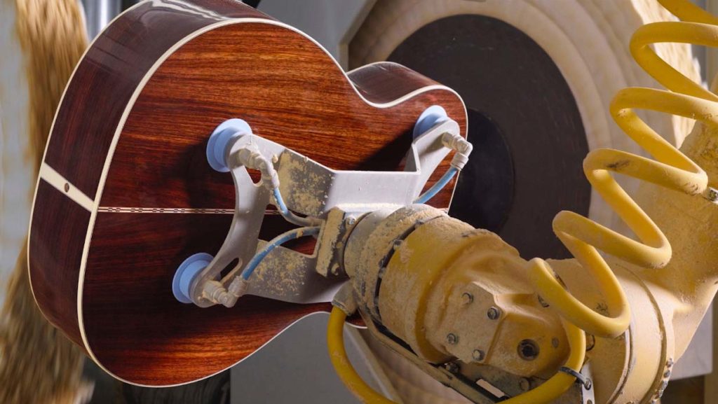 How are Martin and Taylor Guitars designed differently