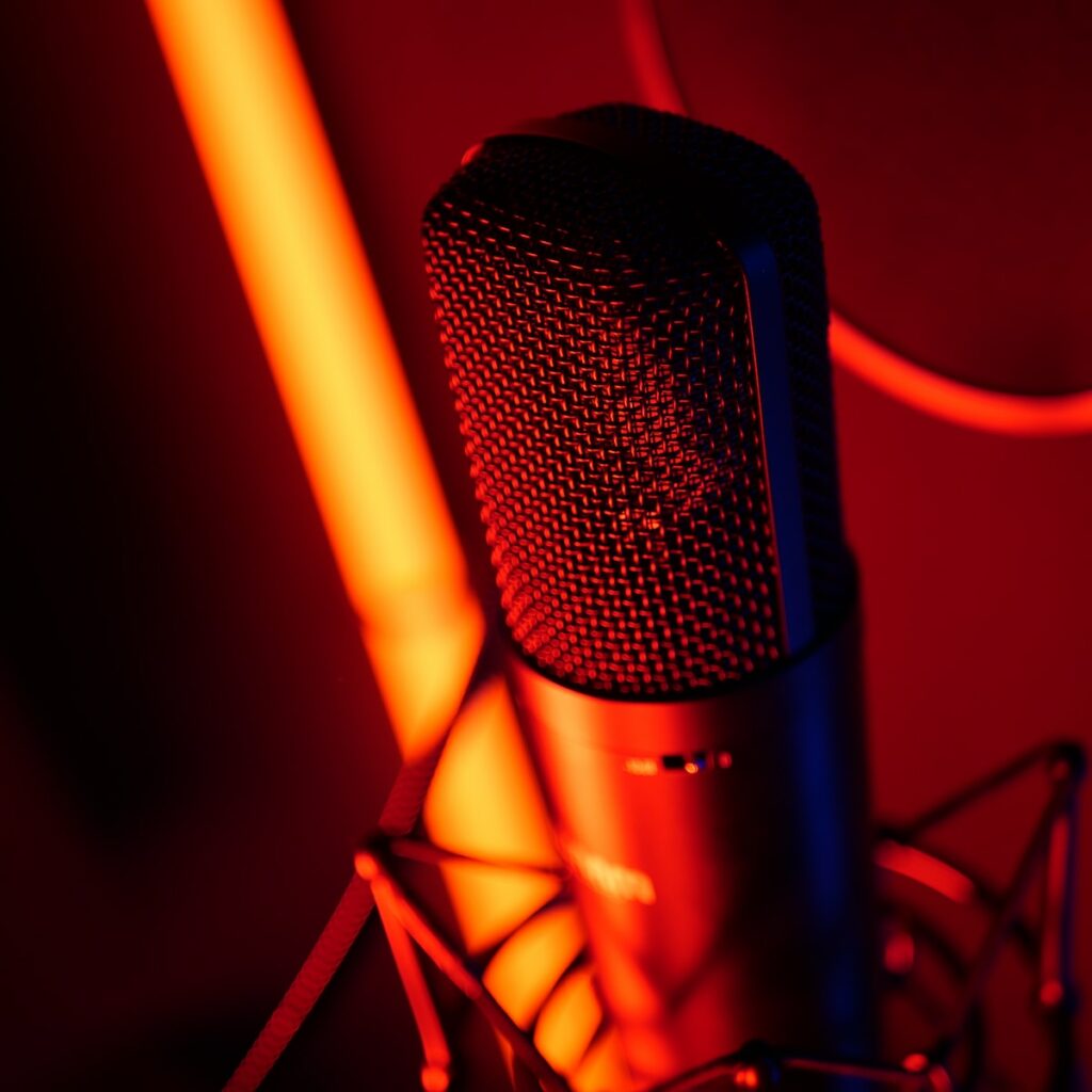 a microphone with a red light behind it